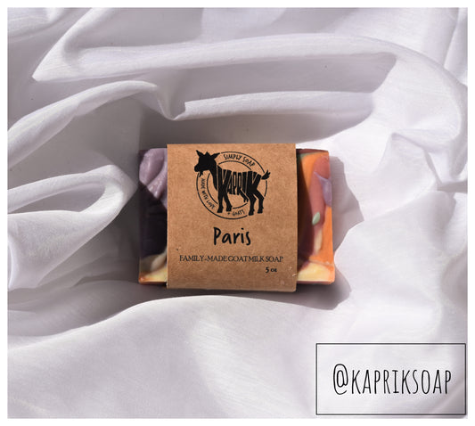 Paris goat milk cold process soap wrapped on white wavy background